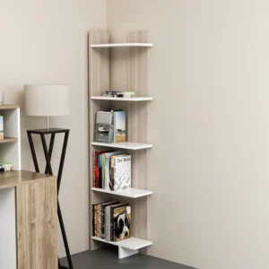 White corner bookcase styled with books plants and decor